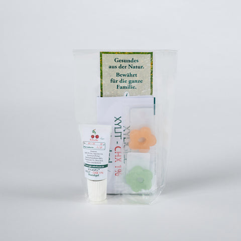 XYLIT-CHX-Gel in der Tube, zwei Xylit Blümchen und Infomaterial, Produktbild