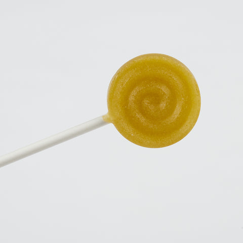 Xylit Lolli Stachelbeere Geschmack, runder flacher Lutscher mit erhabener Spiralform, Produktbild